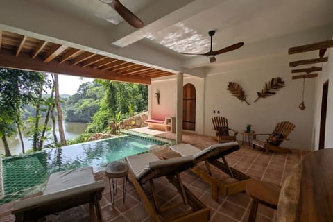 Villa Ora—an artistic three-bedroom riverfront villa near San Ignacio, Belize.