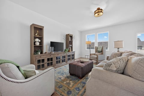 Relax in a bright, inviting living room styled with comfortable seating.