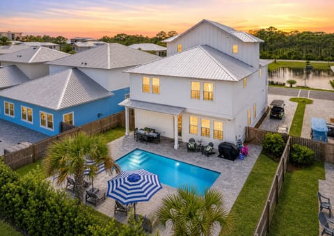 Welcome to Destin Dreamin' | Sleeps 18 with 7 King Suites, an arcade Bunk Room, private saltwater pool with optional heat, FREE 6-seat golf cart, community pool access, and peaceful pond views.