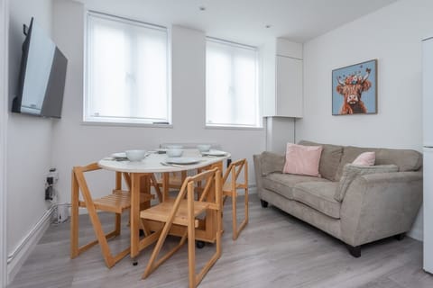 Living Room with Dining Table and TV