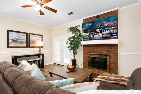 Cozy living room with fireplace & smart TV