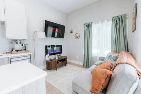 The Sage Desert — a modern, desert-inspired retreat featuring a cozy bedroom, stylish living space, and fully equipped kitchen. Located in a sleek, newly built community, this space blends comfort, design, and convenience for a relaxing stay.