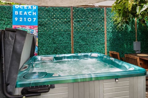 Unwind in your private hot tub after a day at the beach.
