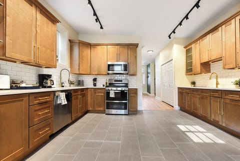 Fully equipped kitchen featuring brand-new stainless-steel appliances and tons of cabinet storage