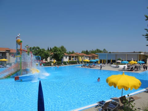 Water, Sky, Swimming Pool, Building, Plant, Umbrella, Outdoor Furniture, Leisure, Tree, Chair