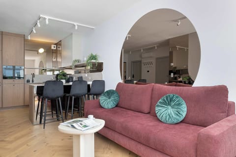 Relax in the stylish living room with a comfortable sofa and modern decor.