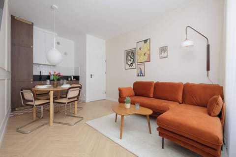 Relax in the stylish living room with a comfortable sofa and modern decor.