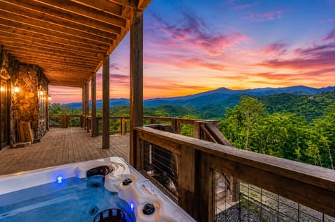 Soak and relax in your own private hot tub with stunning mountain views.