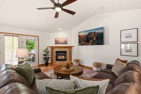 The open layout invites you to relax with a book or enjoy an evening gathered around the coffee table.