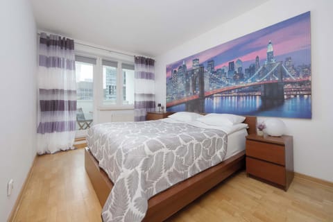 A spacious bedroom with a large double bed for a restful night's sleep. Warm décor creates a relaxing atmosphere.