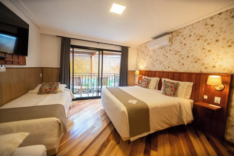 Family Room, Balcony, Garden View | Desk, iron/ironing board (on request), cribs (surcharge), WiFi (free)