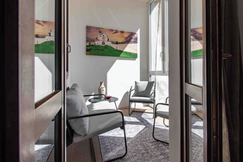 Apartment (1 Bedroom) | Living area | 32-inch Smart TV with cable channels