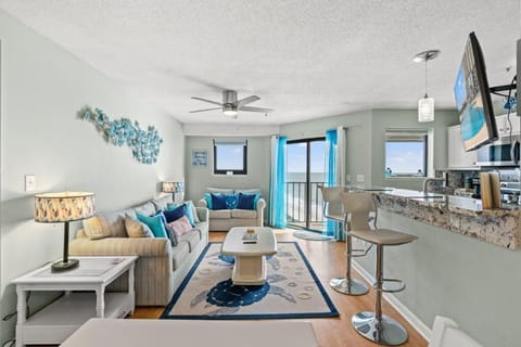Spacious Living Area with Comfortable Lounge and Flat Screen TV