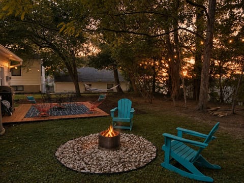 Fire pit, patio, grill, hammock and dining table.