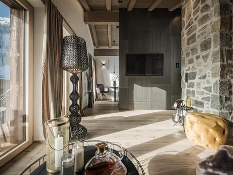 Deluxe Suite, Balcony, Garden View | Living area | TV