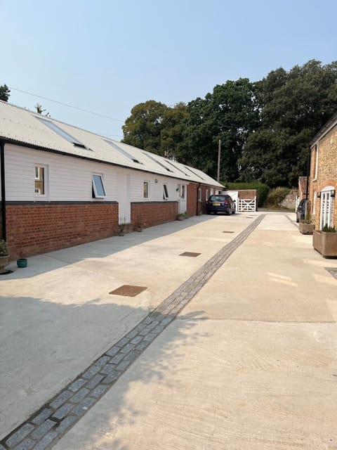 External view of the Cowshed and vehicular entry into yard.