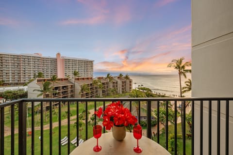 Enjoy morning coffee or evening cocktails from the furnished balcony with sweeping ocean and resort views.