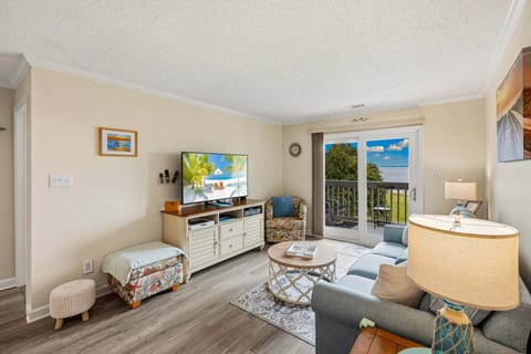 The bright and welcoming living room is designed for relaxing after a day of exploring Manteo.