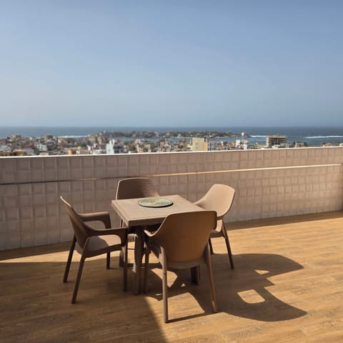 Deluxe Penthouse, Balcony, Beach View | Outdoor dining