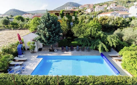 Pool with sun loungers & sitting area