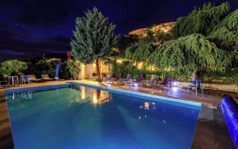 Pool with sun loungers & sitting area