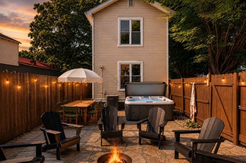 Backyard: Gather in the cozy backyard to soak in the hot tub, enjoy the warmth of the fire pit, challenge friends to ping pong, or simply unwind in the comfortable seating area.