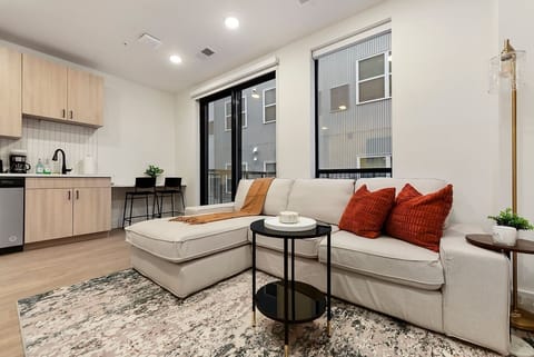 Living Room With Tons of Natural Light + Patio Access