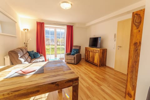 Comfort Apartment | Living area | Flat-screen TV