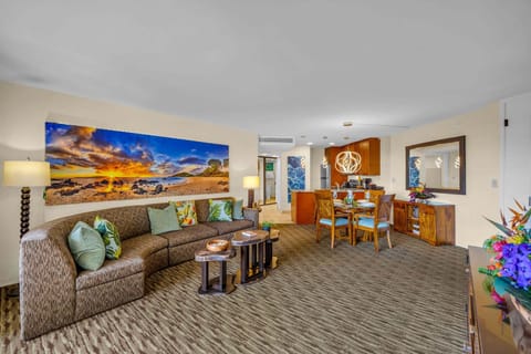 Relaxation framed by beach‑scene art and cozy seating, perfect for unwinding after a day in the sun.