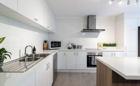 recently renovated kitchen with gourmet appliances.  Fridge has ice maker and iced water, induction cook top etc 