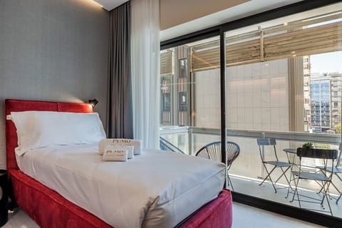 Luxury Triple Room, Balcony, Garden View | In-room safe, desk, laptop workspace, blackout drapes