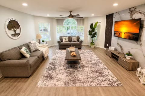 Spacious living room with comfortable seating area and plenty of room to unwind.