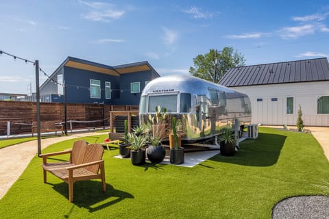 The hidden courtyard at the heart of the property, with fire pits, pickleball, and shaded places to gather. Private when you want it, social when you don't.