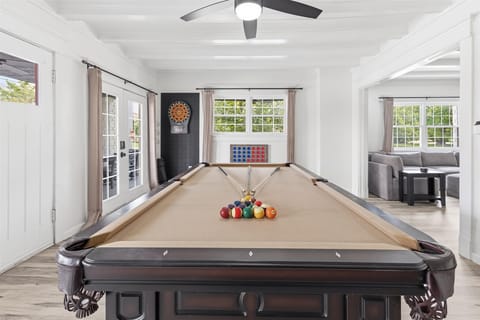 Game room with pool table, darts, connect4, and plenty of board games