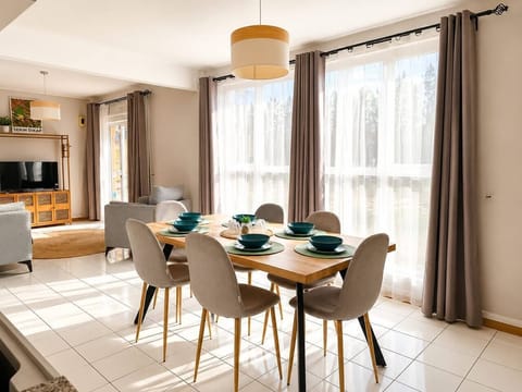 Bright, open living and dining area filled with natural light.