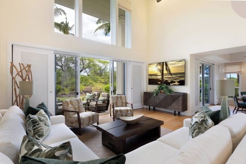 This large great room with new furniture offers a tropical ambiance