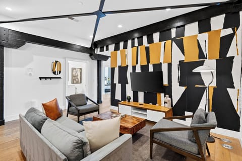 Welcome to Mic Drop! A bold, playful two-bedroom condo set squarely in the heart of downtown Nashville.