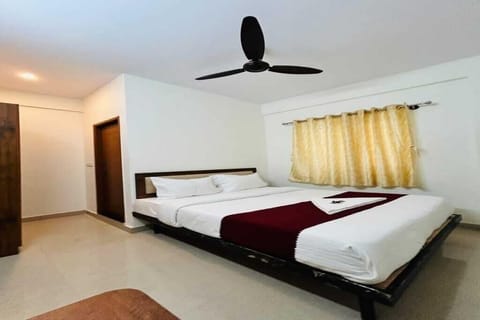 Deluxe Double Room, City View | In-room safe, desk, laptop workspace, iron/ironing board