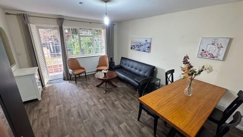 Bright living and dining area with comfortable seating.