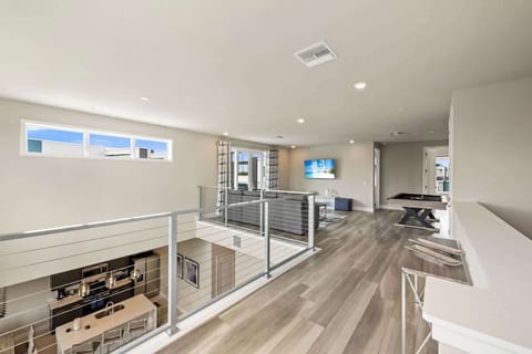 Unit 222 Loft View: Stand above the action—enjoy an elevated perspective of the open, sun-lit living space below.