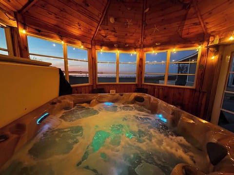 Enjoy an enclosed hot tub year-round! The gazebo offers 360° screened windows for comfort in any season.