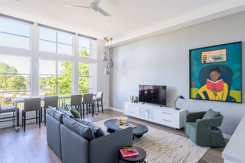 Bright living room with sofa and smart TV