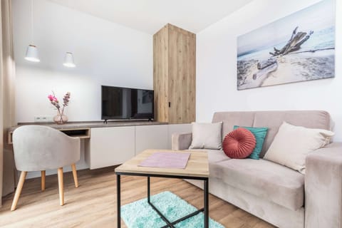 Relax in the stylish relaxation area with a comfortable sofa and modern decor.