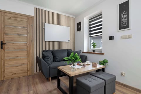 Relax in the stylish living room with a comfortable sofa and modern decor.