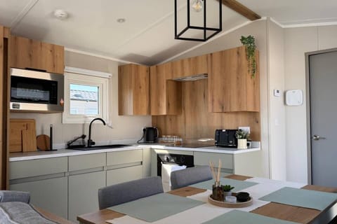 The modern, fully equipped kitchen has everything you need to make your stay feel like home.