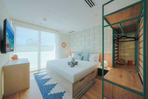 Your coastal retreat awaits with ocean-view windows, a plush bed with storage, and beachy accents that capture the relaxed vibe of your seaside escape.