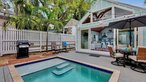 Welcome to THE POETIC PARROTFISH, a classic Conch cottage where color splashes around every corner...
