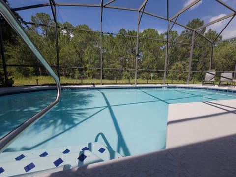 Private screened pool with sunny deck and peaceful wooded views