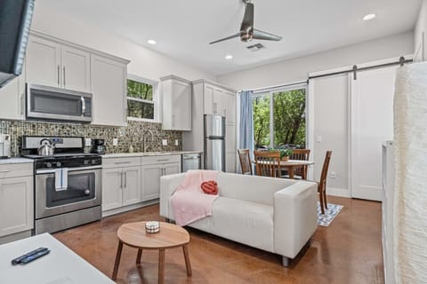 Open-concept living and kitchen with a gas range and coffee bar make hosting the whole group easy.