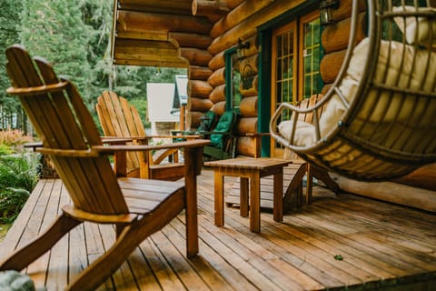 Relaxing back deck surrounded by nature.